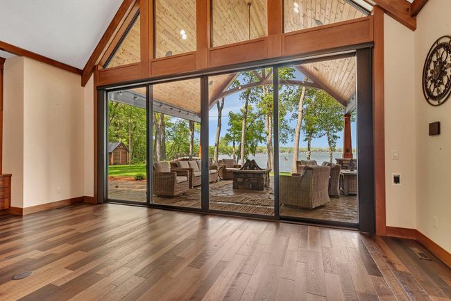 Grand wall of windows offering breathtaking views of Big Fish Lake, bringing the beauty of the outdoors inside. | Image 32