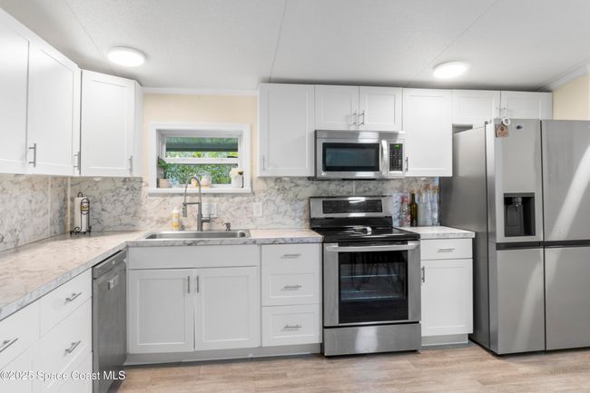 1039 Wren Cir, House other with 3 bedrooms, 2 bathrooms and null parking in Barefoot Bay FL | Image 13