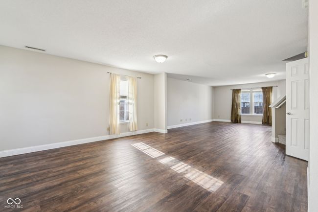 Walking in through the front entry is open floor plan, offering homeowner a plethora of space. | Image 8