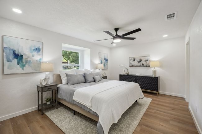 Bedroom with wood finished floors, baseboards, recessed lighting, and a ceiling fan | Image 17