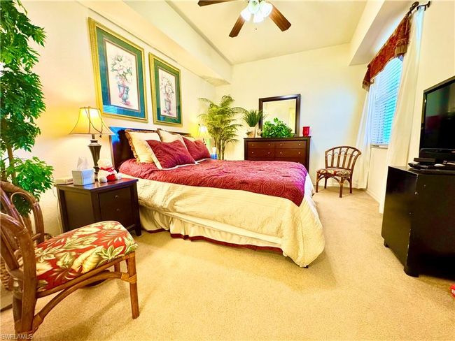 Bedroom with carpet flooring and ceiling fan | Image 17