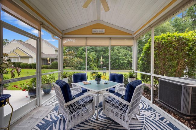 Sunroom with ceiling fan, lofted ceiling, and outdoor dining space | Image 22