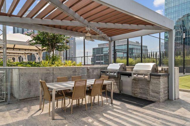 After enjoying one of four grills and two accompanying dining tables by the pools for an al fresco meal with friends, consider retiring to one of two fire pit seating areas to relax under the evening sky. | Image 57