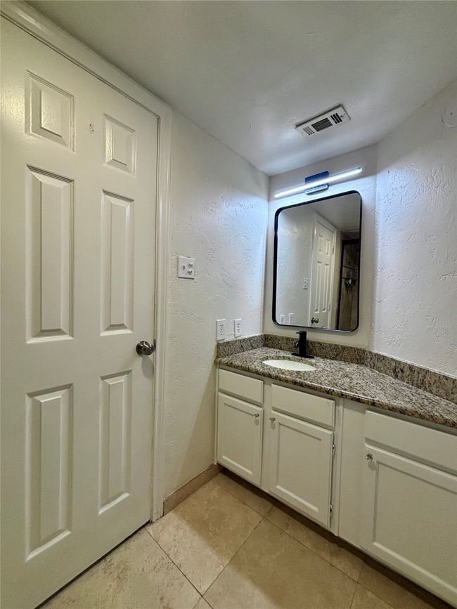 Bathroom featuring vanity and tile style patterned floors | Image 12