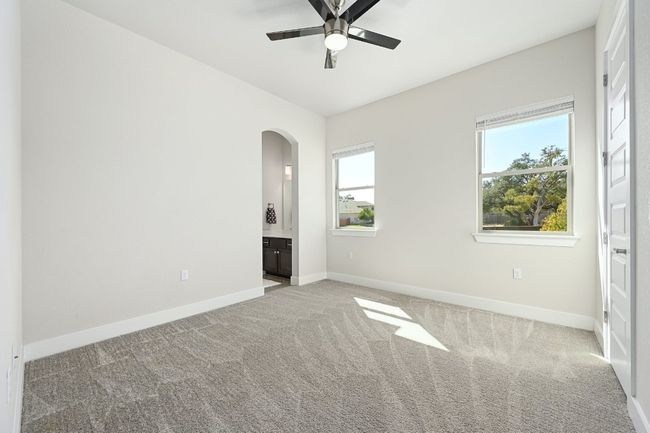 Two additional bedrooms are perfect for family members or guests, offering comfort and privacy. | Image 18
