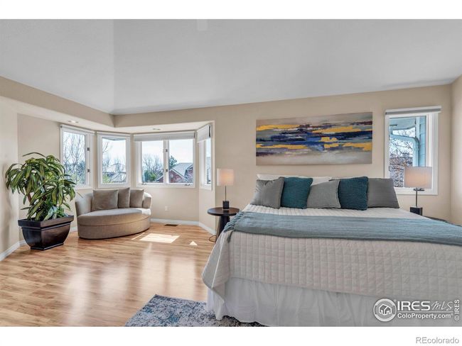 Large Primary bedroom features bayed window sitting area | Image 17