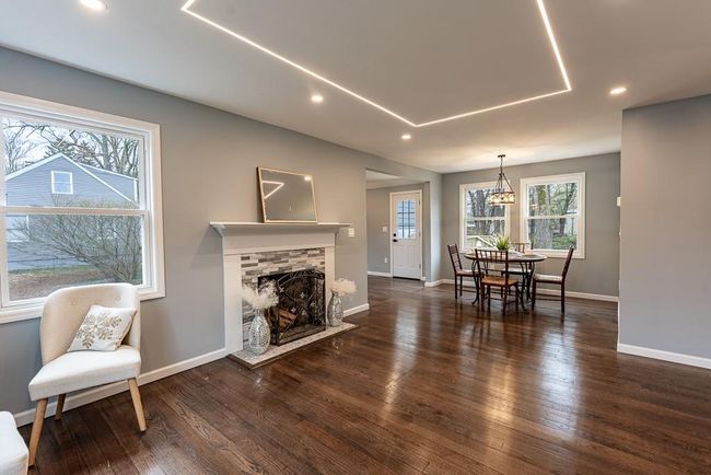Living room featuring recessed lighting, a fireplace, baseboards, and hardwood / wood-style flooring | Image 4