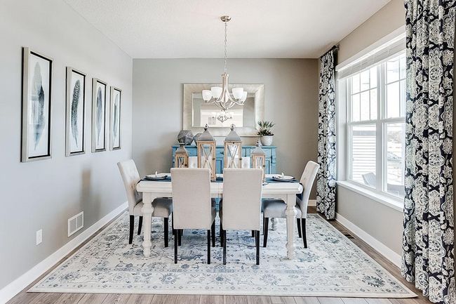 A formal dining room off of front entrance is open & inviting. Photo of model home, color & options may vary. | Image 7