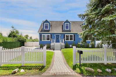 Storybook cape with white picket fence in Piermont! | Image 1