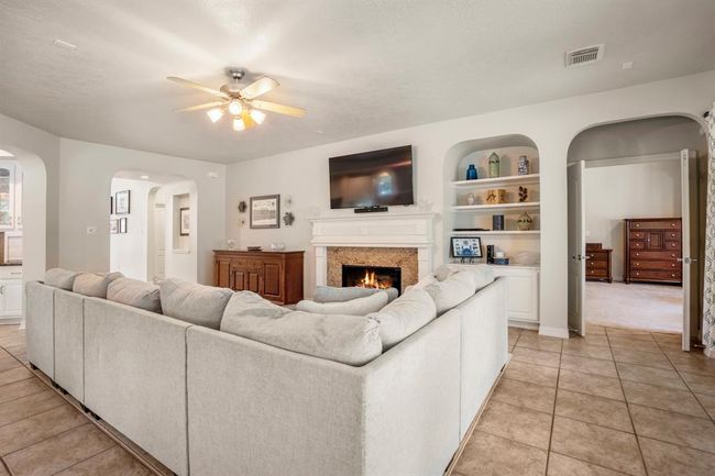 The built in entertainment shelves offer a tucked away place for your TV equipment. | Image 13