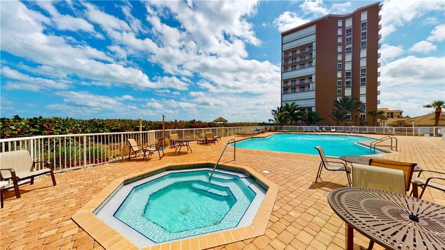 Pool, hot tub and view of 4160 building. | Image 31