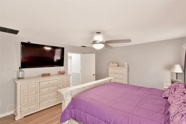 Bedroom featuring light wood-style floors and a ceiling fan | Image 22
