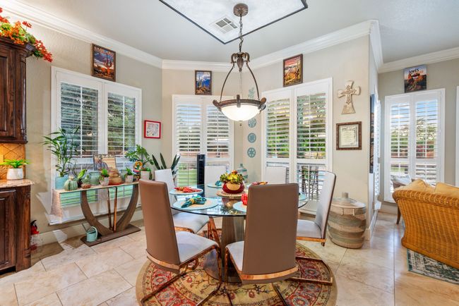 Dining area featuring ornamental molding | Image 26