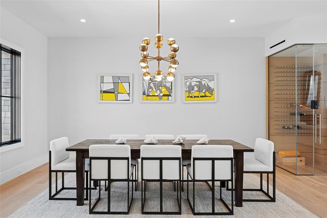 Dining room featuring wood finished floors, baseboards, recessed lighting, and a chandelier | Image 5