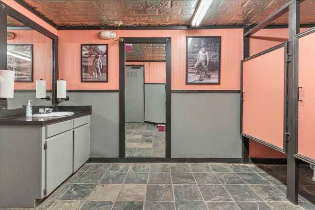 Bathroom featuring vanity, an ornate ceiling, and stone finish floors | Image 18