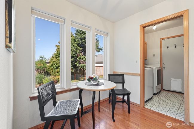 Another view of breakfast area leading to laundry room and garage entry. Washer and dryer stay as well. | Image 19