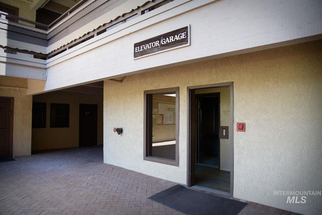 View of exterior entry featuring stucco siding and a patio | Image 22
