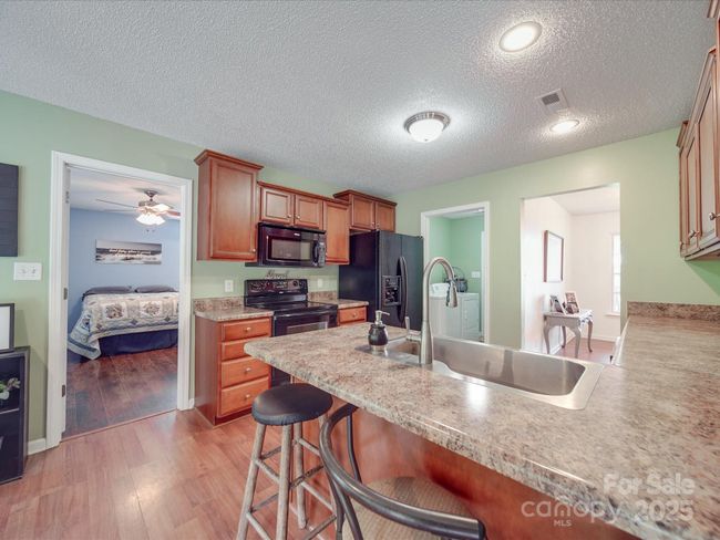 Kitchen with Breakfast Bar | Image 26