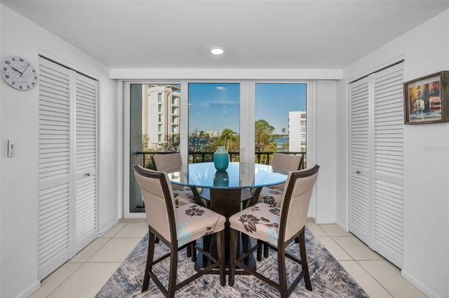 The breakfast table in the kitchen, with walk in laundry to the left and walk in pantry to the right. Water views included! | Image 7