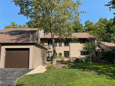 View of front of property with a garage and a front lawn | Image 1