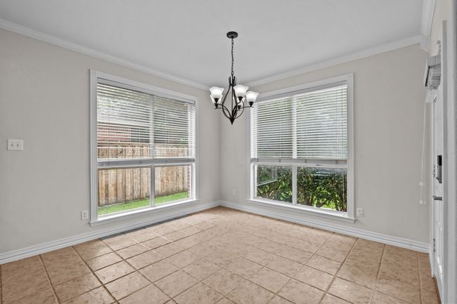 Charming breakfast nook before windows | Image 15