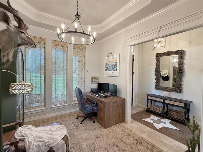 Versatile front room which can be used for home office or formal dining area. | Image 8