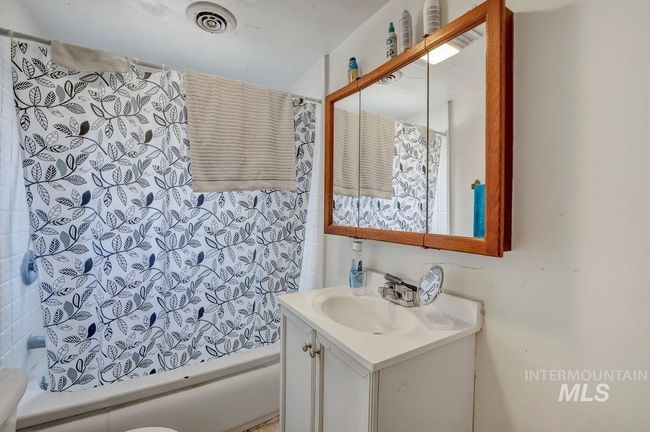 Full bath with vanity and shower / bath combination with curtain | Image 22