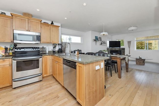 Kitchen with stainless steel appliances and granite countertops | Image 5
