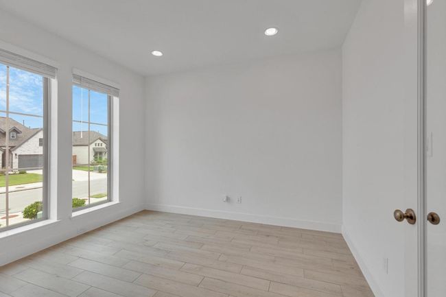 Empty room featuring light wood-style floors and recessed lighting | Image 6