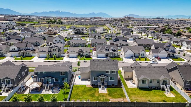 Aerial perspective of suburban area featuring a mountain backdrop | Image 43