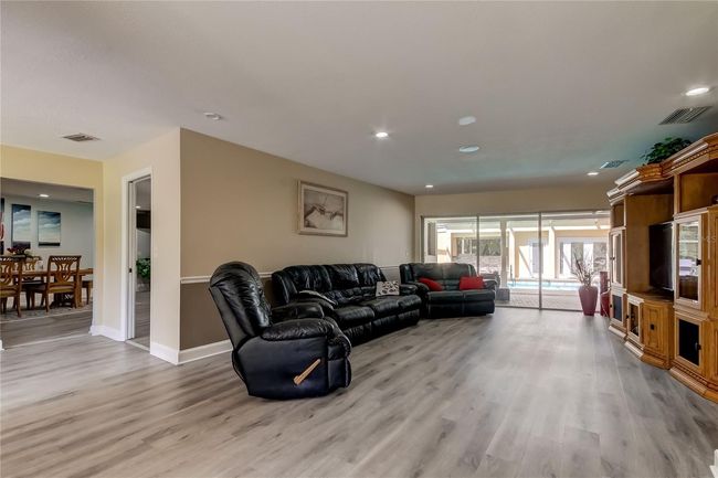 Living room overlooking pool when you come through front door | Image 7