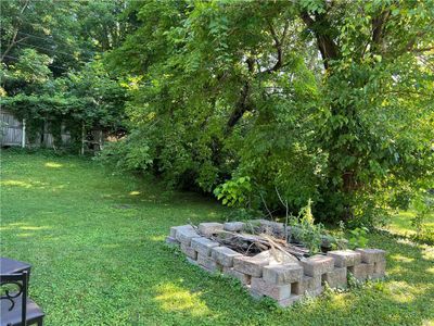 View of yard featuring a fire pit | Image 2