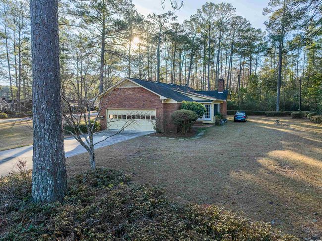 View of side of home featuring a garage | Image 6