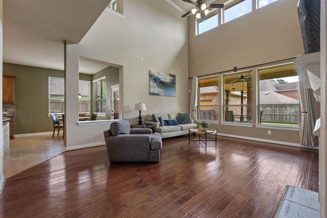 The open concept between the kitchen, dining nook, and living room are perfect for entertaining. | Image 11
