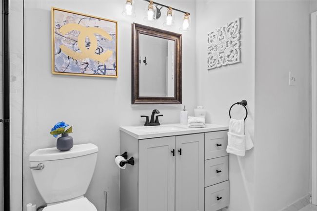Bathroom featuring toilet and vanity | Image 28