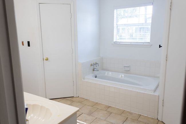 Full bathroom featuring a bath, vanity, and tile patterned floors | Image 16