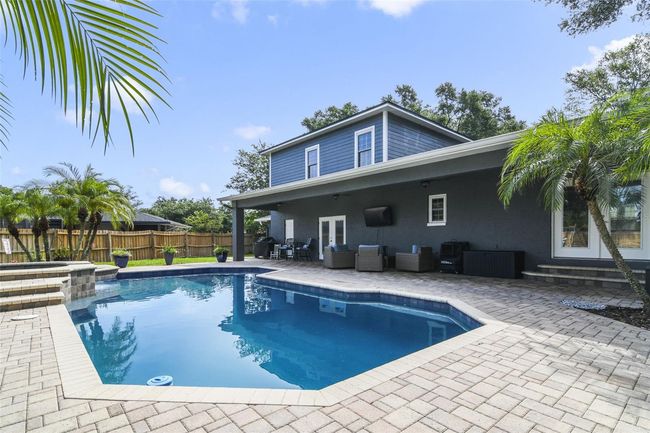 The ideal backyard for entertaining - covered seating, pool, spa & lots of green space! | Image 19