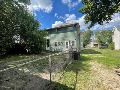 Back of house featuring a lawn | Image 2