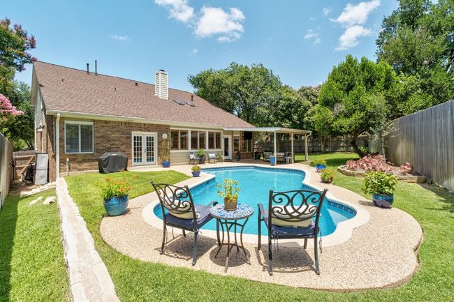 View of pool with french doors, a fenced backyard, area for grilling, and a patio | Image 22