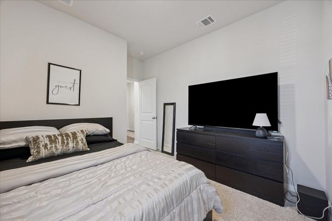 Bedroom with carpet and baseboards | Image 32