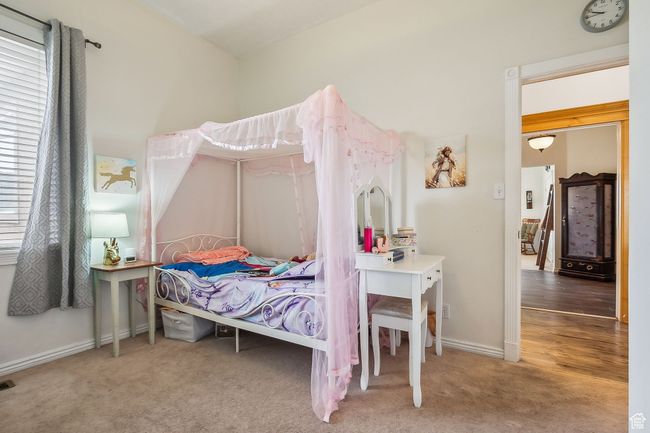Bedroom with visible vents, baseboards, and carpet floors | Image 27