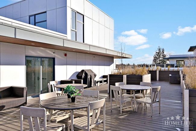 Wooden terrace featuring outdoor dining area | Image 20