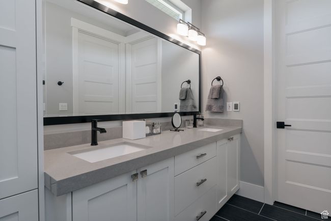 Full bath with double vanity and baseboards | Image 21