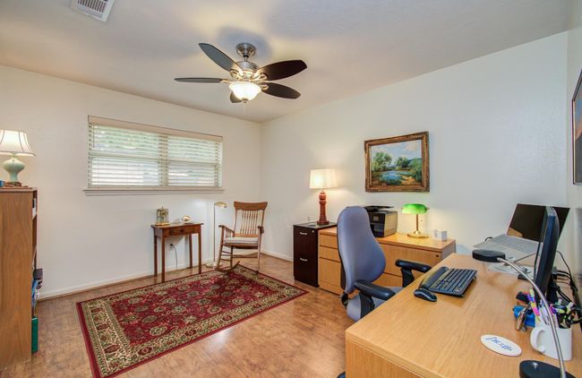 This secondary bedroom boasts wood floors. | Image 32