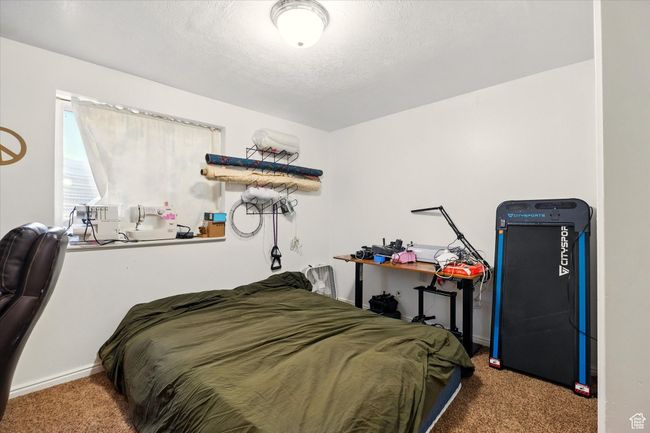 Carpeted bedroom featuring baseboards | Image 27