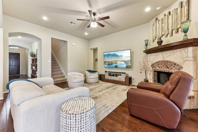 A wall of windows fills the room with natural light, while the layout offers plenty of flexibility for your favorite furniture and personal touches | Image 9