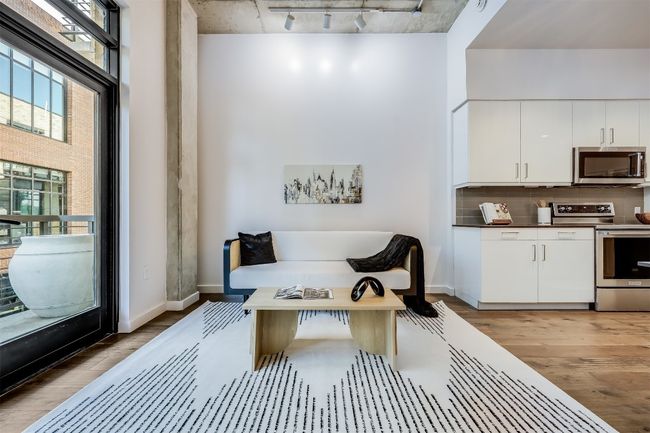 The open floorplan means you’re not stuck with a specific furniture arrangement; the space works whether you’ve got a full sectional or just a couple of low-profile chairs | Image 8