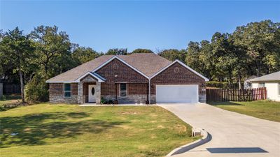 View of front of property with a front lawn and a garage | Image 1