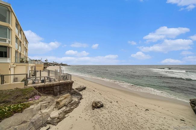 Walk right out onto and down the sandy beach . | Image 30