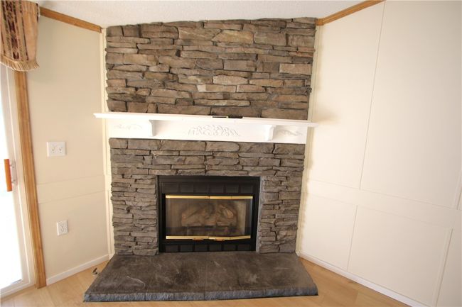 Stunning Stone Gas Fireplace w/ Wood Mantel | Image 10